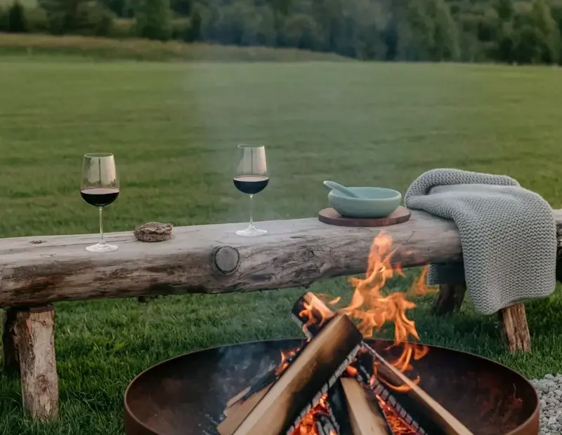 Backyard Fire Pit Evening with Wine on a Rustic Log Table | Cozy Sunset Vibes