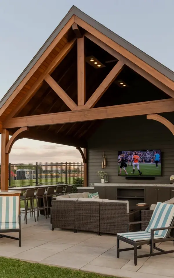 Covered Patio Entertainment Area with TV and Wicker Sectional for Football Season