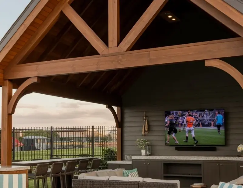 Covered Patio Entertainment Area with TV and Wicker Sectional for Football Season